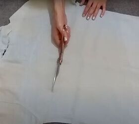how to easily turn t shirts shirts into trendy tops, Cutting out the back