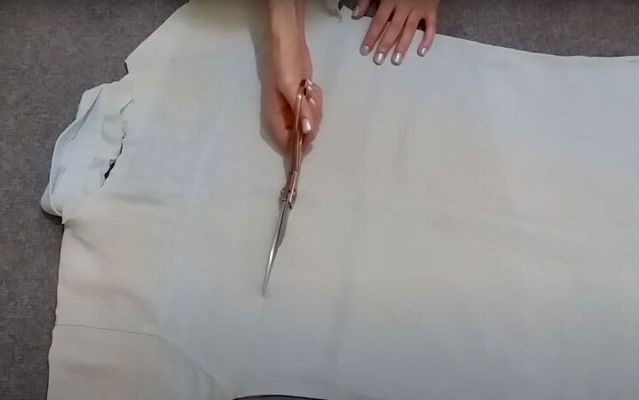 how to easily turn t shirts shirts into trendy tops, Cutting out the back