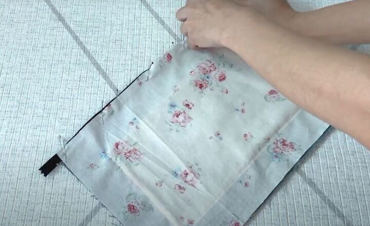 how to make a cute diy denim clutch bag out of an old jean dress, Adding the bag lining fabric
