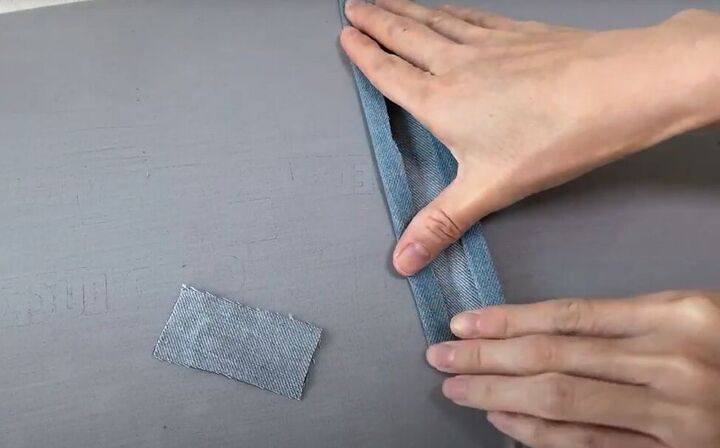 how to make a cute diy denim clutch bag out of an old jean dress, How to make the strap