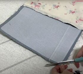 how to make a cute diy denim clutch bag out of an old jean dress, Snipping the corners
