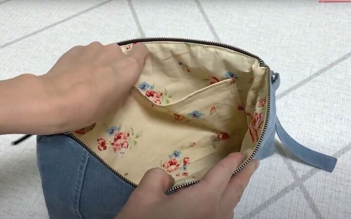 how to make a cute diy denim clutch bag out of an old jean dress, Inside the DIY denim clutch bag