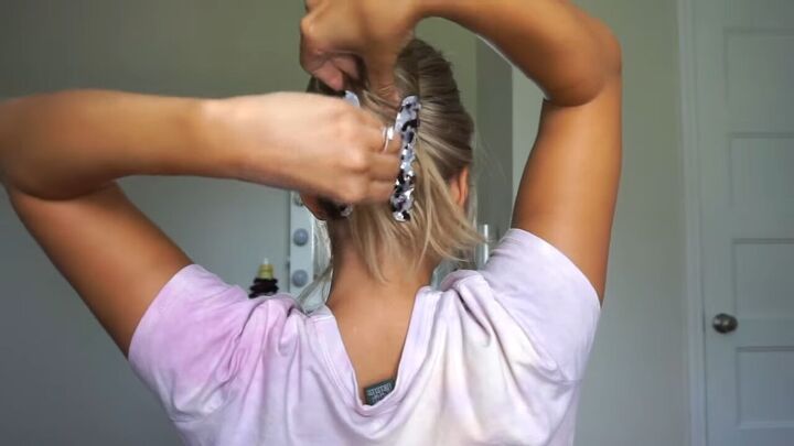 looking for claw clip hairstyles here are 6 super easy ideas, Using a claw clip to secure the hair underneath