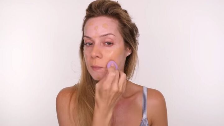 covid makeover easy beginners makeup for when you re sick, Using a beauty blender to bounce the foundation over the skin