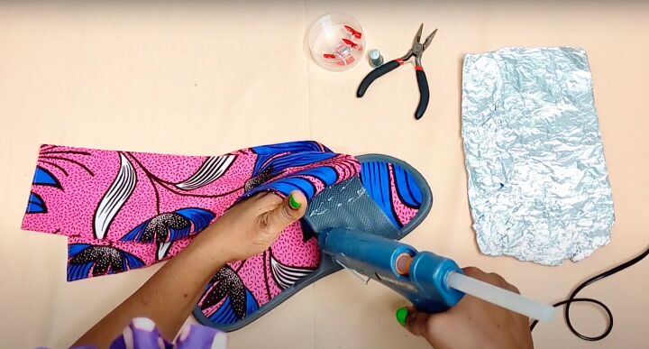 how to make cute diy slide sandals with african ankara fabric bows, Hot gluing the Ankara fabric