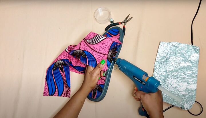how to make cute diy slide sandals with african ankara fabric bows, Applying hot glue to the outer edge