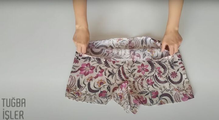 how to make cute diy shorts in a wrap front skirt overlay style, Sewing the pinned areas