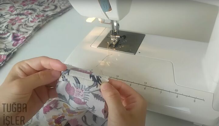 how to make cute diy shorts in a wrap front skirt overlay style, Flattening the seams with a finger