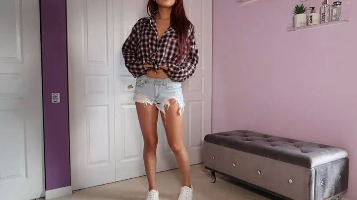 13 simple and trendy ways to style an oversized button up shirt, Ripped denim shorts with a flannel shirt tied in a knot