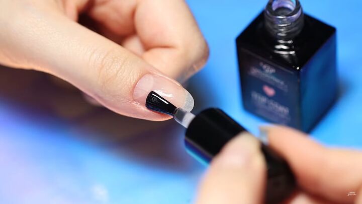 how to do mesmerizing aurora ice korean nail art 3 ways, Applying a top coat to nails