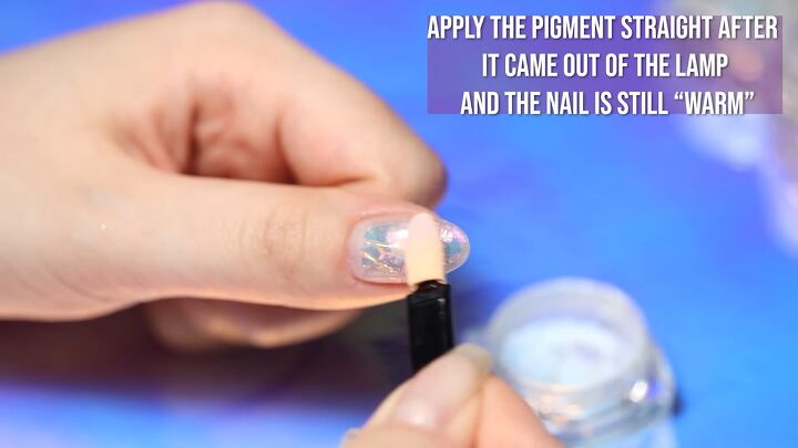 how to do mesmerizing aurora ice korean nail art 3 ways, Applying a blue powder to nails