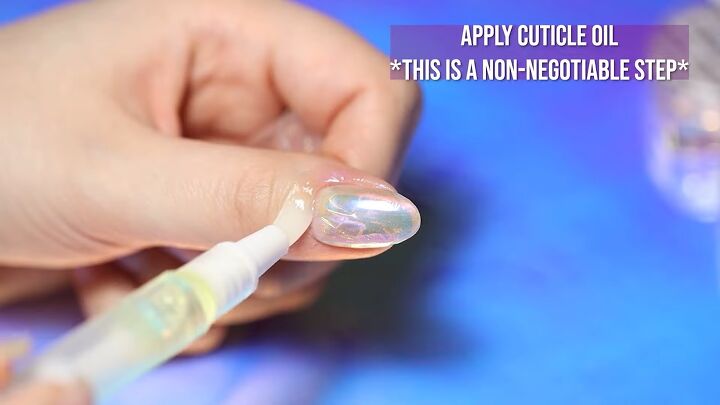 how to do mesmerizing aurora ice korean nail art 3 ways, Applying cuticle oil