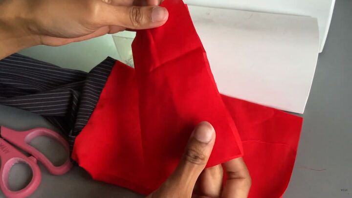 how to make a color block shirt using your grandad s old clothes, Folding the cuff ready to sew