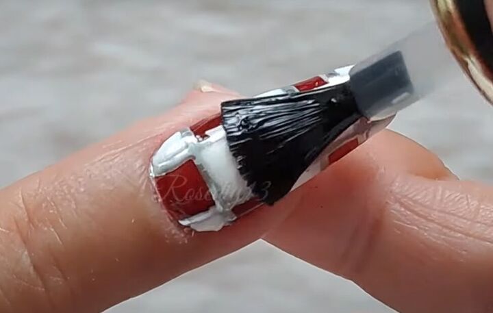 how to do quick simple red white nail art, Applying a top coat over the top