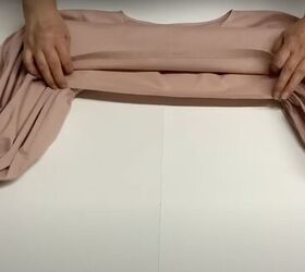 how to sew a diy puff sleeve top with dropped shoulders, Pressing and hemming the top