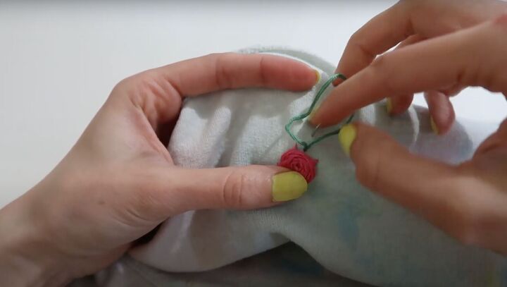 7 smart sewing hacks for beginners how to fix clothes with style, Using green thread to sew the leaf