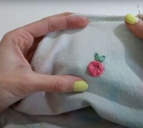 7 smart sewing hacks for beginners how to fix clothes with style, Covering a hole with a rose