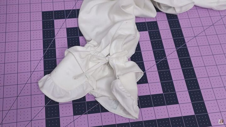 how to make a blouse with frills out of an old men s dress shirt, Tying a bow on the end of the sleeves