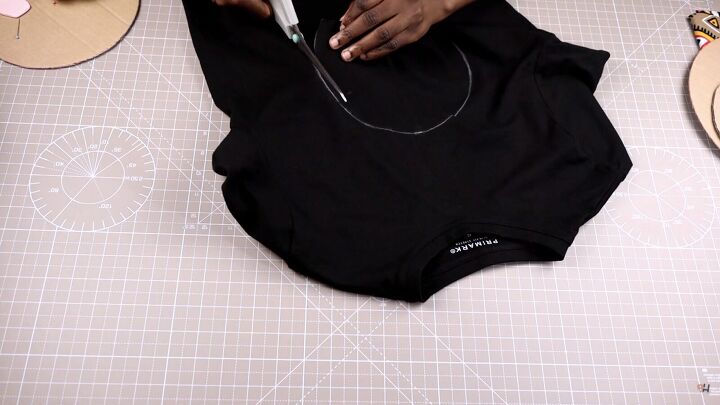 how to customize your old t shirt with a simple circle design, Tracing and cutting the circle