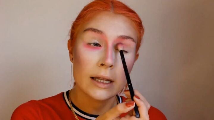 how to do a fun mad hatter makeup look for halloween, Applying pink eyeshadow to the eyelids