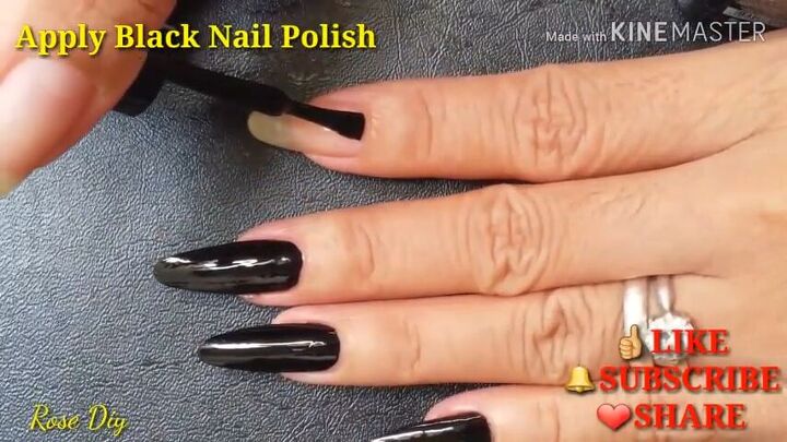 9 steps to creepy halloween nails inspired by the momo challenge, Painting black nail polish onto the nails