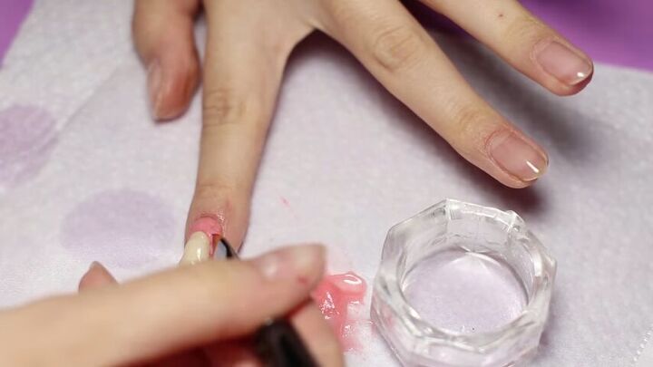 looking for creepy halloween nail art try these diy teeth nails, Applying the tooth to nails