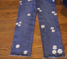 2 diy jean redesigns bling rhinestone trim cute painted daisies, Painting the center of the daisies yellow