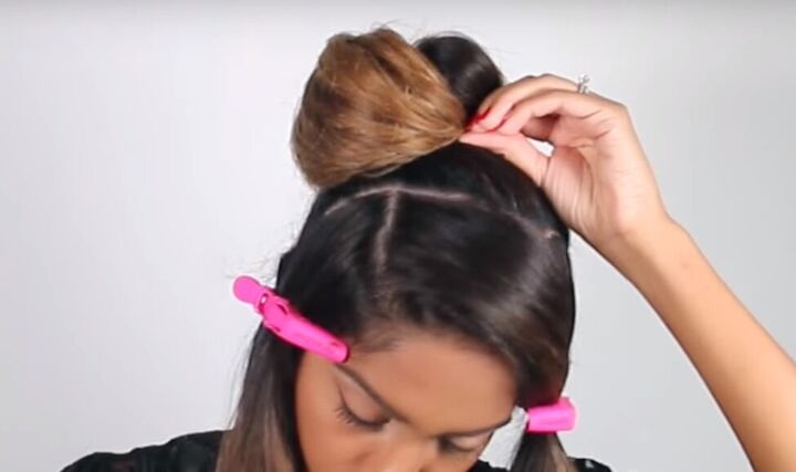 how to create a sophisticated masquerade hairstyle for halloween, Pinning bun in place
