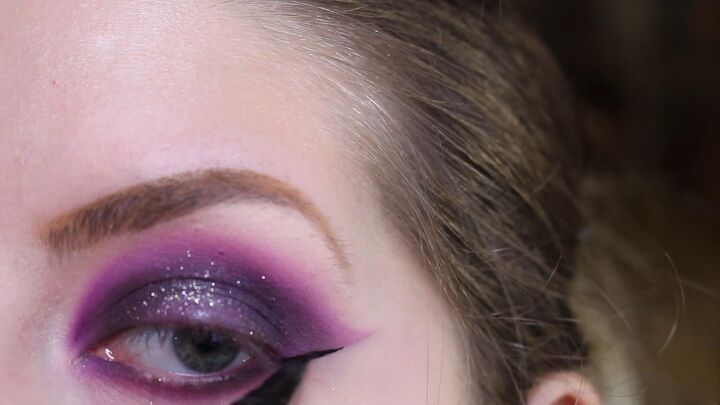 how to do intense purple vampy makeup for halloween, Drawing a wing with liquid eyeliner