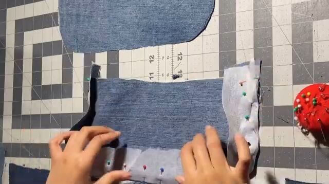 how to make a stylish upcycled shoulder bag, Pinning the body of the DIY denim bag together