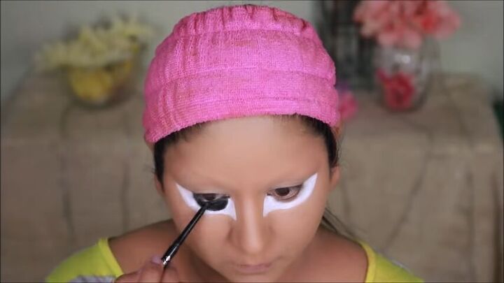how to do bratz doll halloween makeup this year, Applying black eye pencil