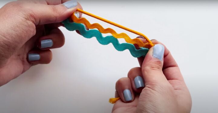 how to make 5 fun hair ties that double as bracelets, Pulling the elastic through the loops