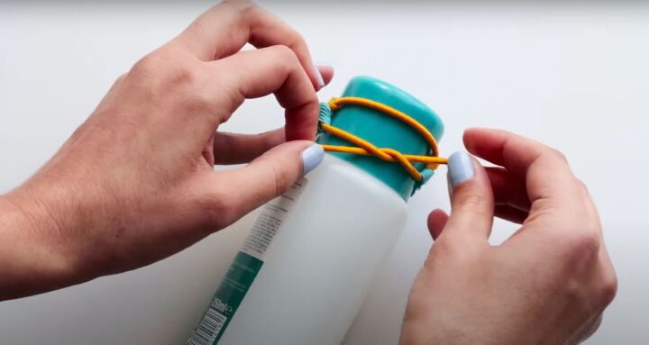 how to make 5 fun hair ties that double as bracelets, Tying the elastic into a bow