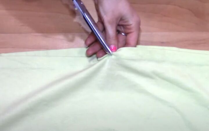 how to transform a t shirt into a drawstring skirt, Snipping drawstring holes