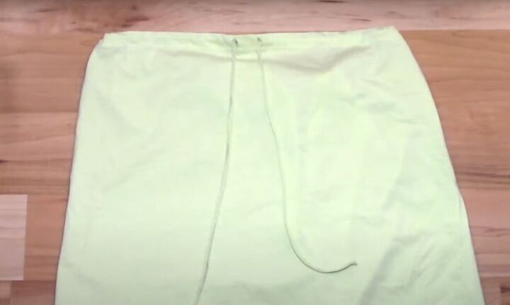 how to transform a t shirt into a drawstring skirt, Drawstrings fully pulled through holes