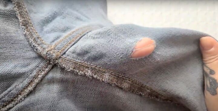 2 easy steps to fix holes in jeans inner thighs, Hole in jeans