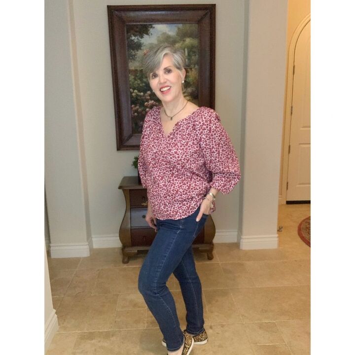 fun teacher outfits, burgundy boho top with an oversized gray cardigan worn over skinny jeans Leopard slip on shoes pearl earrings and amber necklace and a silver charm bracelet