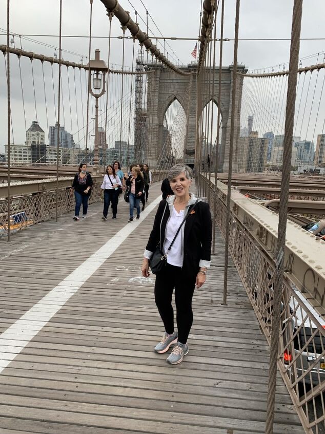 black blazer outfit six different looks, Me on the Brooklyn Bridge wearing the black blazer with gray hoodie insert whote tee gray sneakers black joggers and a blck cross body bag