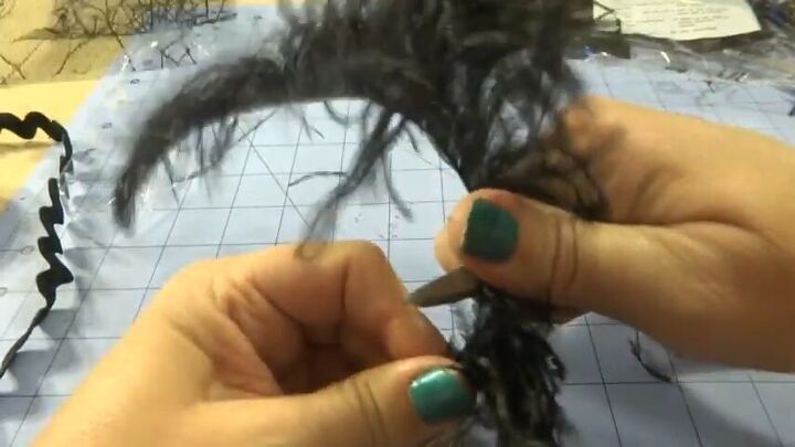 how to create an elegant halloween fascinator, Adding a feather