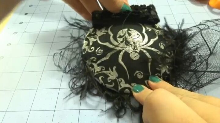 how to create an elegant halloween fascinator, Placing bow at back of hat