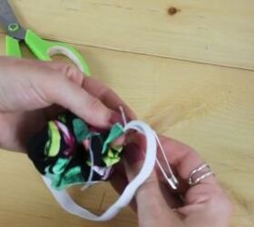 how to make a scrunchie from leftover material, Bringing elastic through the other side of the tube
