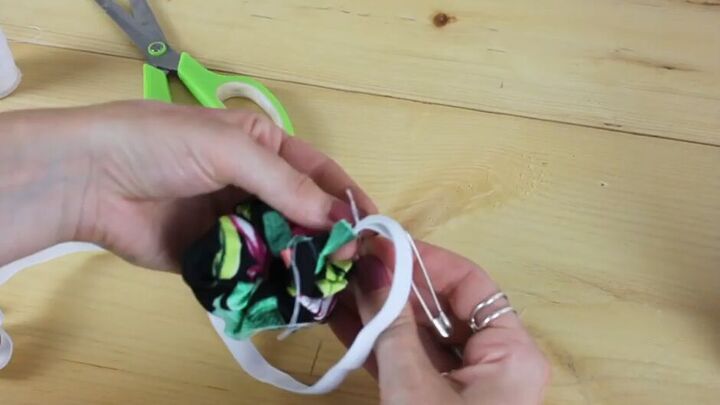 how to make a scrunchie from leftover material, Bringing elastic through the other side of the tube