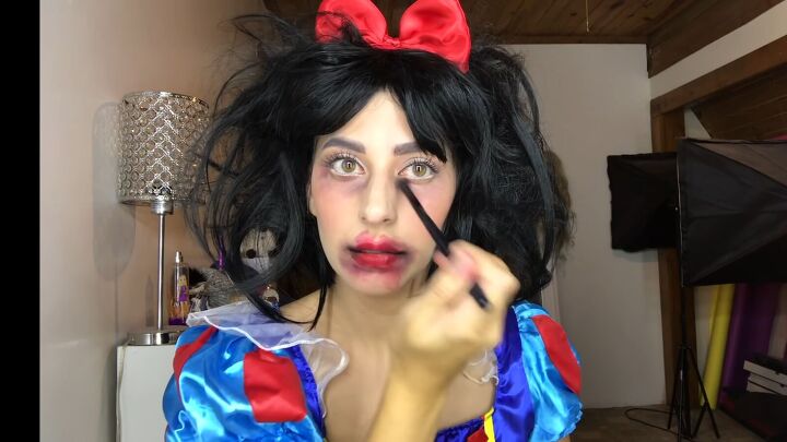 diy spooky poisoned snow white makeup for halloween, Adding black eyeshadow to eye socket