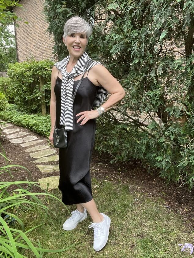 how to wear a slip dress seven different ways, Here is how to wear a slip dress with a striped tee all worn in a casual way My purse is a black crossbody and my shoes are white sneakers