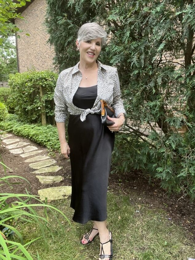 how to wear a slip dress seven different ways, Here I am wearing a black slip dress with a leopard shirt tied over it My bag is black pebbled leather with a tortoiseshell clasp