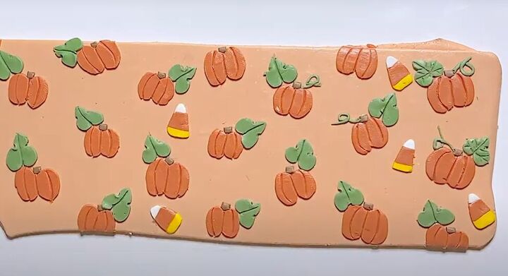 adorable polymer clay pumpkin earrings tutorial, Adding candy corns to peach colored clay