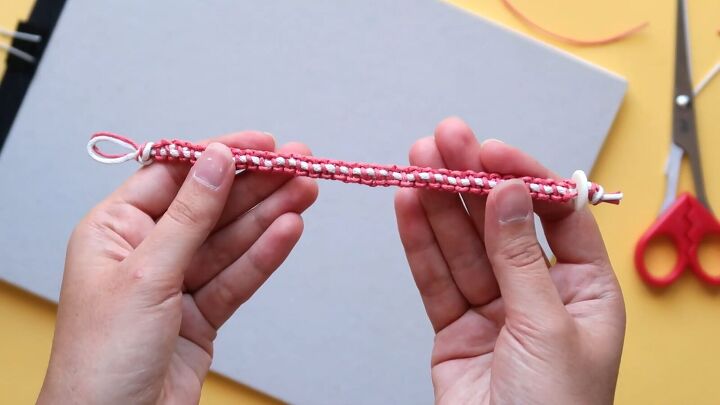 how to make 3 cute macrame friendship bracelets, Completed red and white knot friendship bracelet