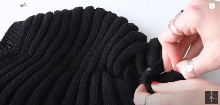 how to make a cozy messy bun beanie, Stitching the hair elastic into place