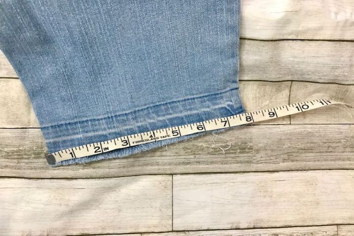 how to easily create stylish pant cuffs with a simple sewing hack, measuring raw edge of jeans hem for our simple sewing hack