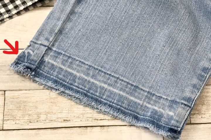 how to easily create stylish pant cuffs with a simple sewing hack, jean pant with pins on seams used in our simple sewing hack